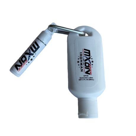 Two white bottles with 'MXON' branding on a light gray surface.